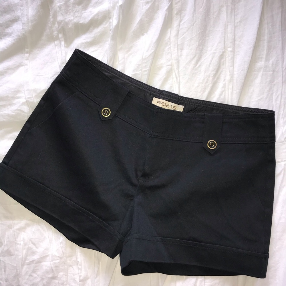 Black shorts with gold buttons